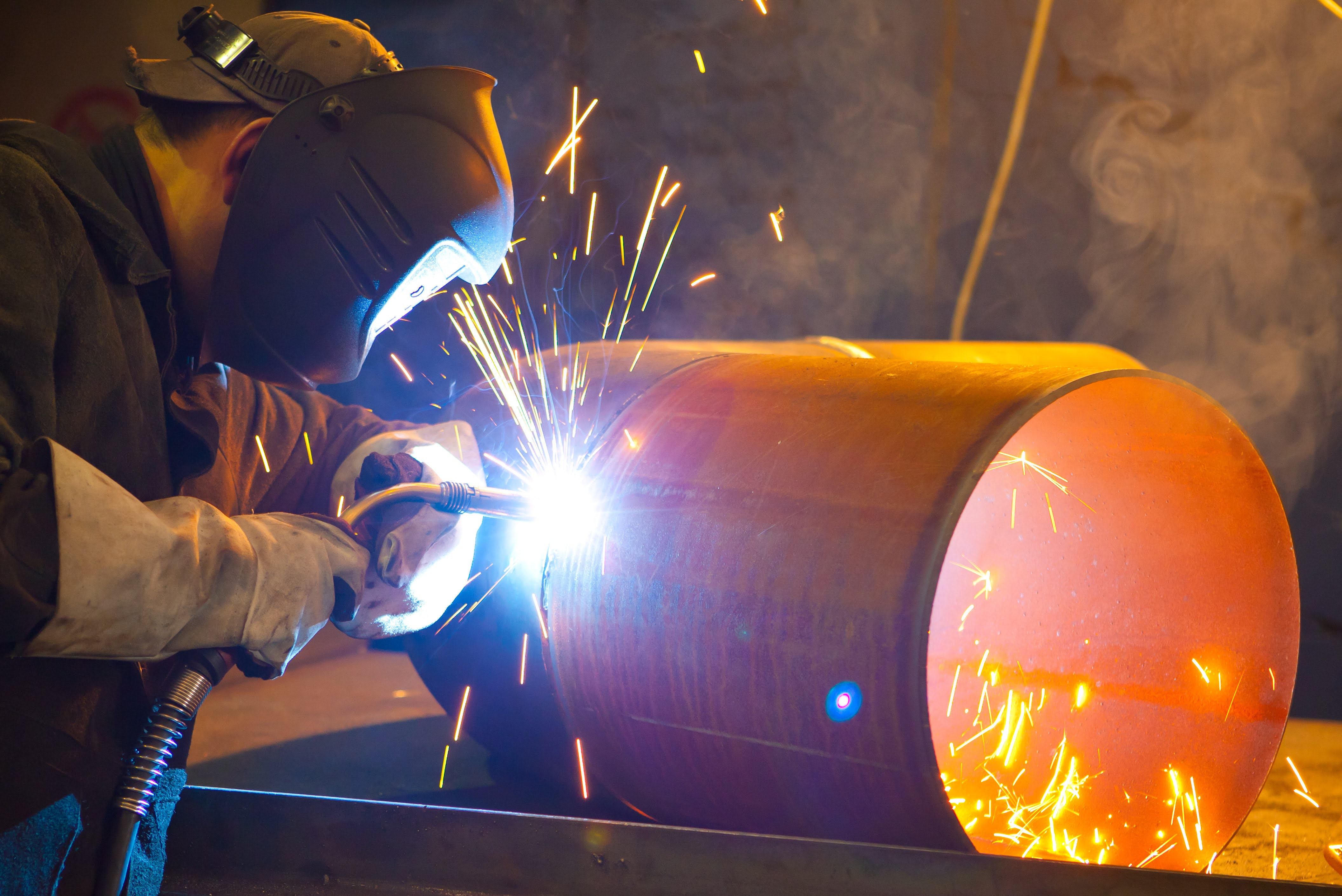 Welder using protective gear on the job