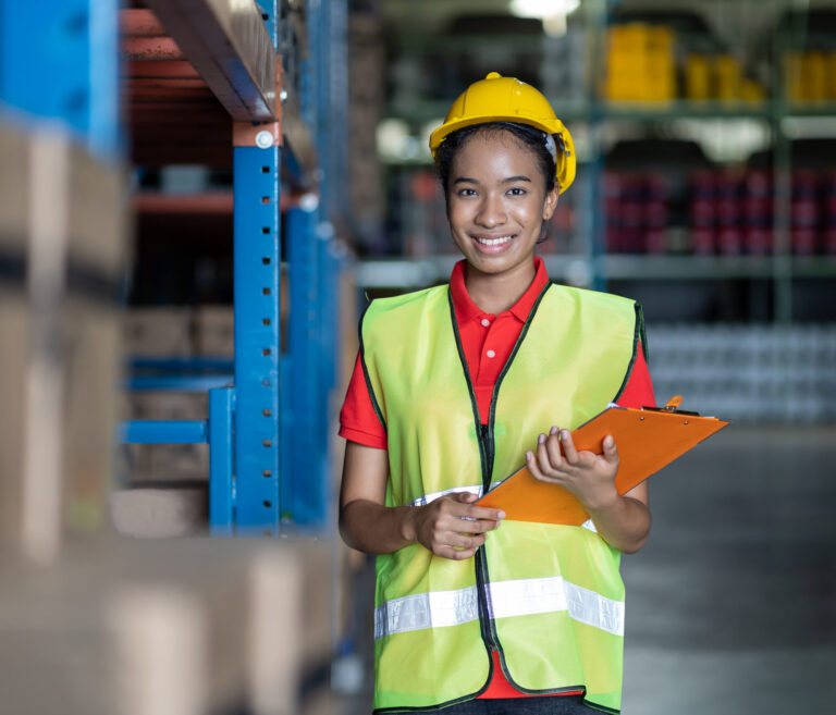 African American woman worker using clipboard working with produ